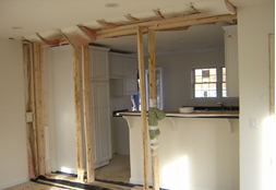 VIEW OF KITCHEN FROM DINING ROOM AREA SHOWS TEMPORARY FRAMING AT THE MATING WALL AND WORK NEEDED TO COMPLETE THE TRANSISTION FROM DINING ROOM TO KITCHEN.
